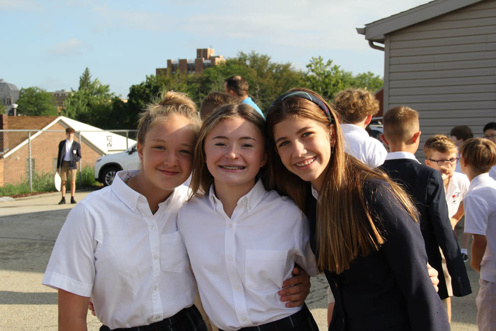 Three female students in school uniforms