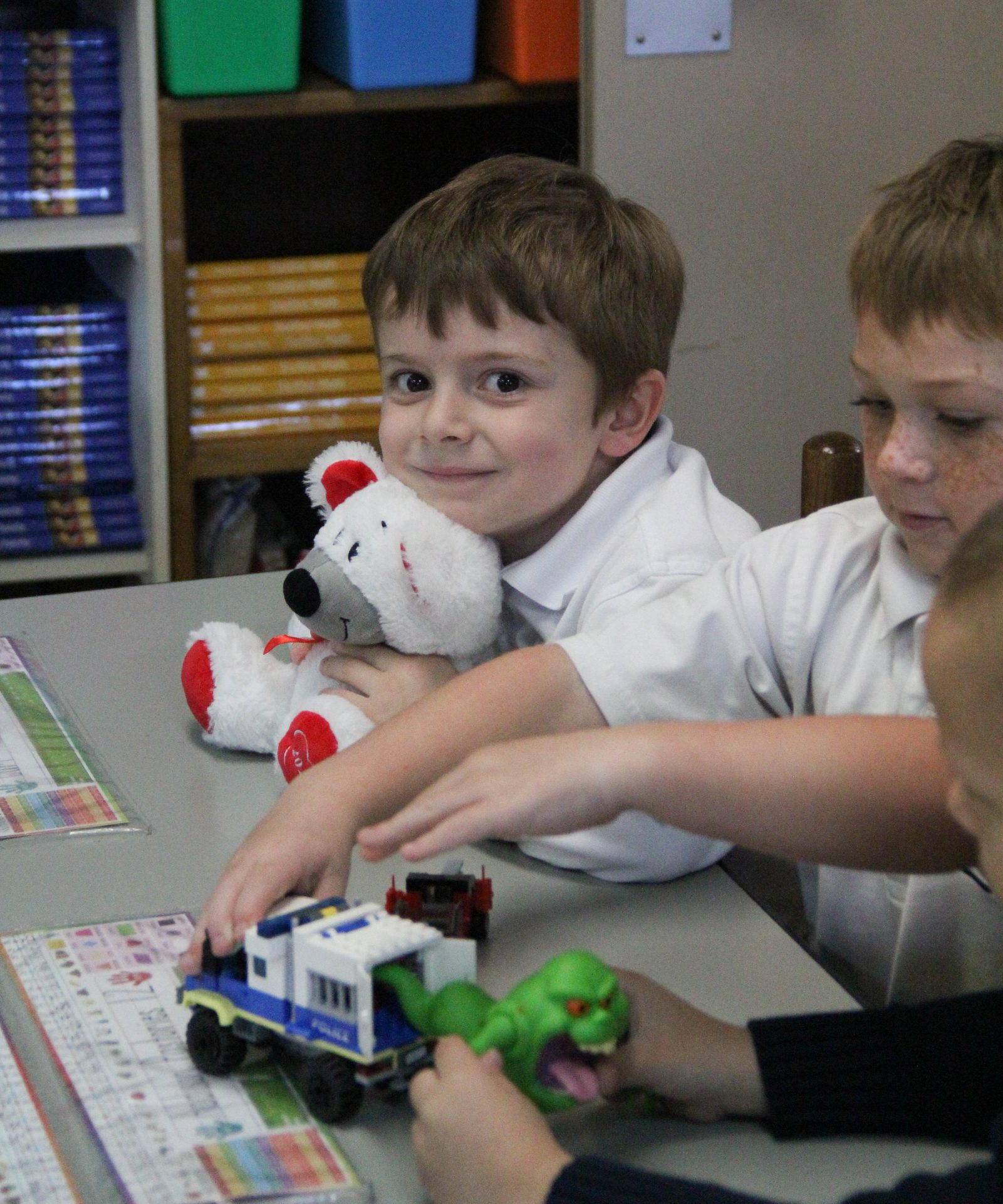 Kindergarten students playing at a table