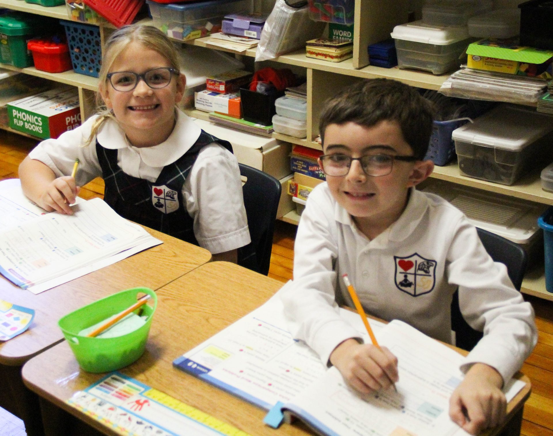 Two students sitting at their desks